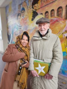 Mbah & Granddad with Le Petit Prince book.